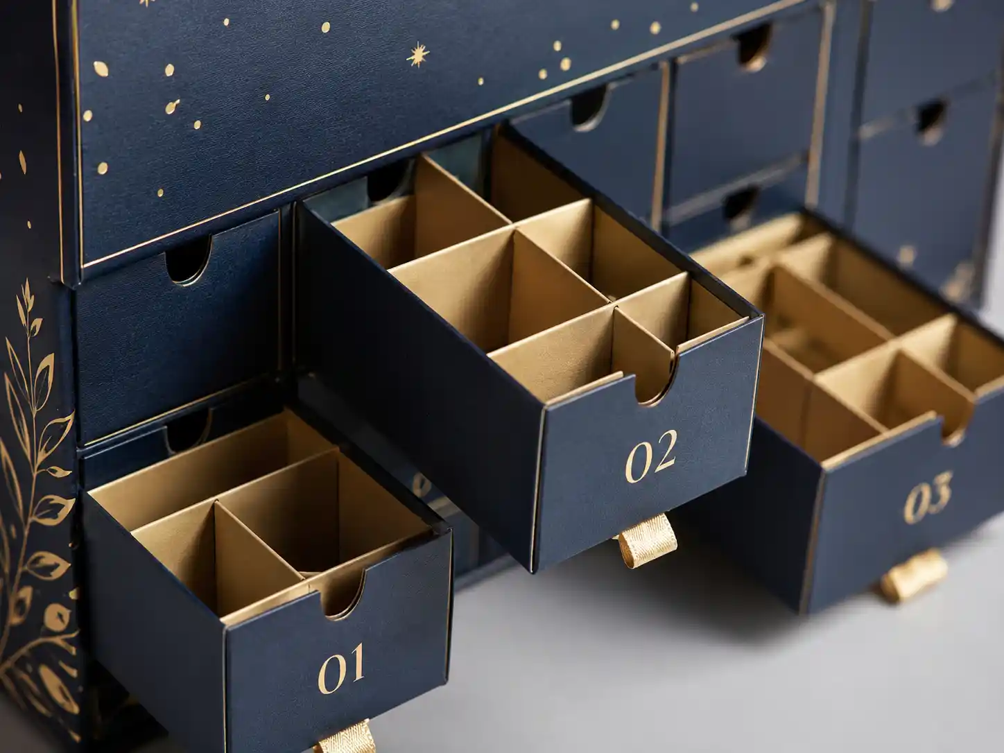 Macro detail of drawer compartments and paperboard dividers for window advent calendar boxes