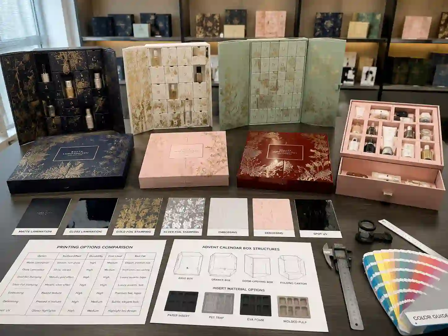 B2B comparison of printed beauty advent calendar box structures and finishing options in a packaging showroom