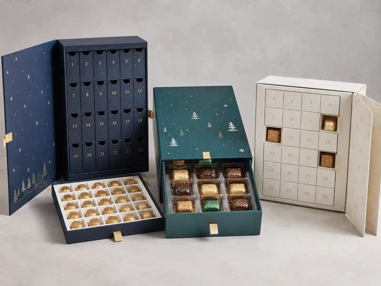 Finished chocolate advent calendar boxes showing rigid, drawer, and folding carton structures with fitted inserts