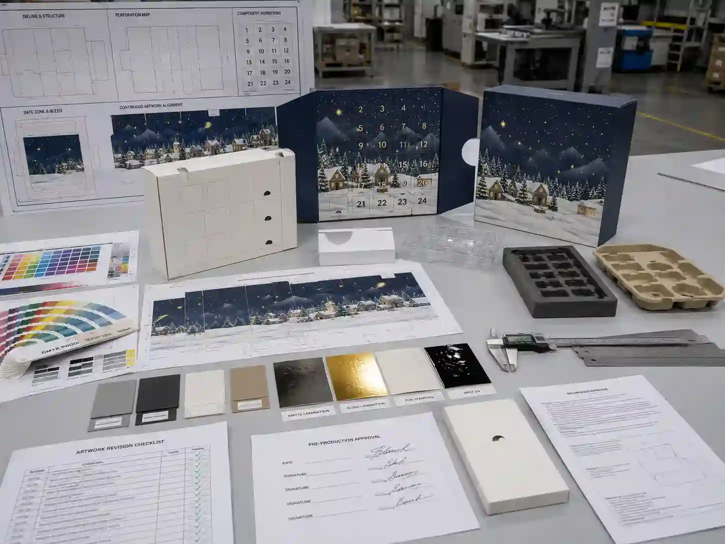 Advent calendar dieline, artwork, insert, material, and sample alignment review on a factory development table