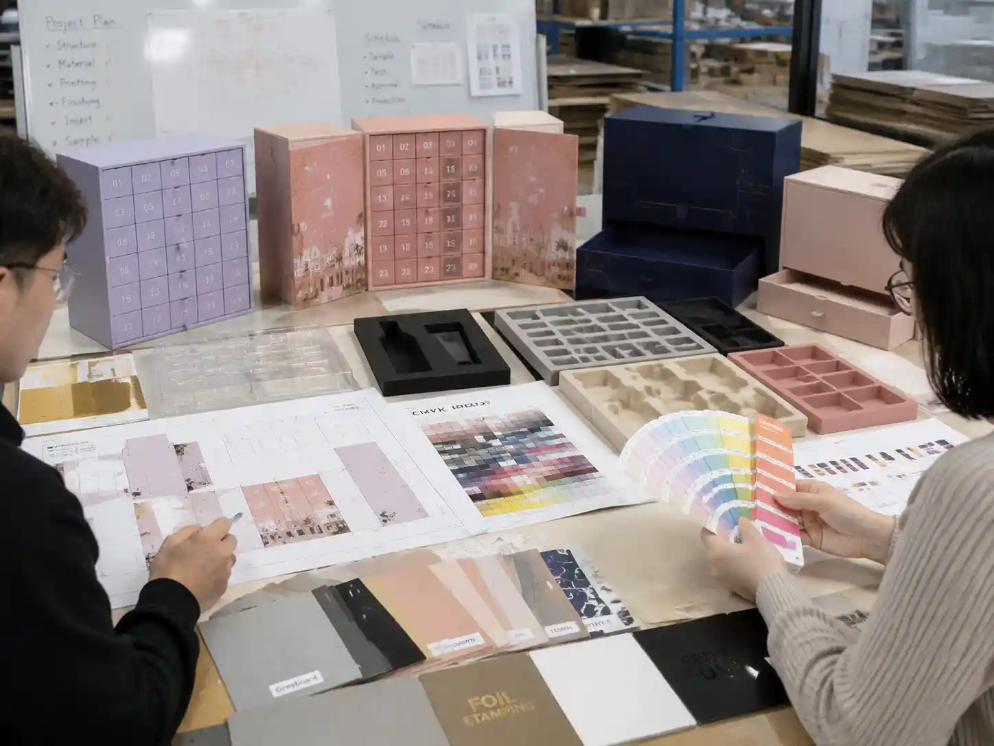 Packaging engineers reviewing skincare advent calendar box printing samples, materials, inserts, and artwork proofs