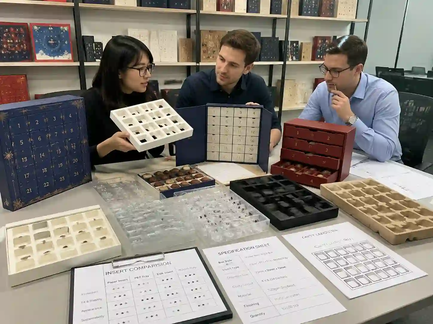B2B comparison of insert options for chocolate advent calendar boxes including paper insert PET tray EVA and molded pulp samples